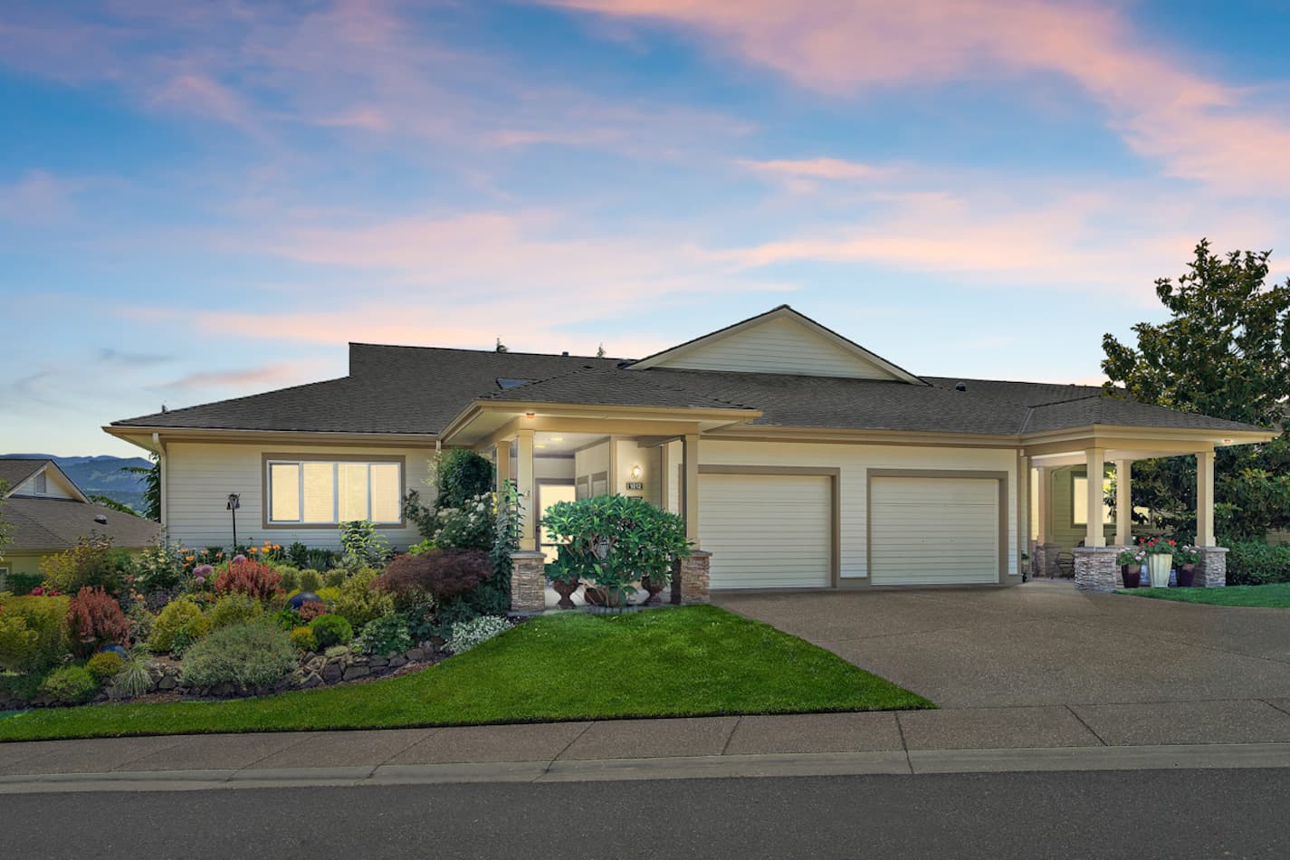 Exterior photo of a Rogue Valley Manor residence at dusk.